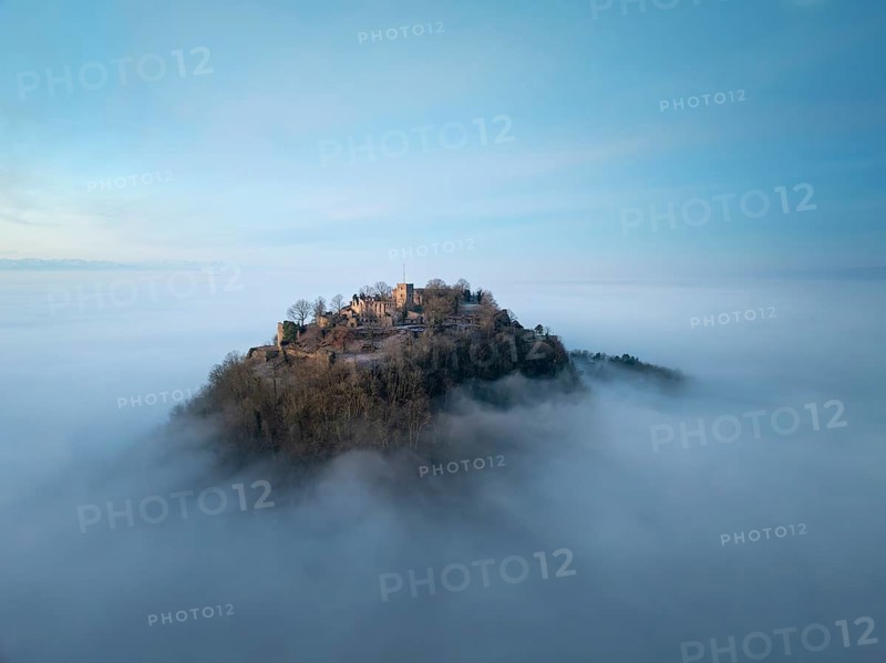 Aerial view of the Hegau volcano Hohentwiel with the upper fortress ruins in front of sunrise, rising out of the fog during an inversion, district of Constance, Baden-Württemberg, Germany, Europe
