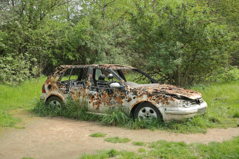 Artwork at the Auto Biennale, 2019, street art, rusted, rusty, renaturalisation, nature, VW, Golf, scrap car, Völklinger Hütte, Völklingen, Saarland, Germany, Europe