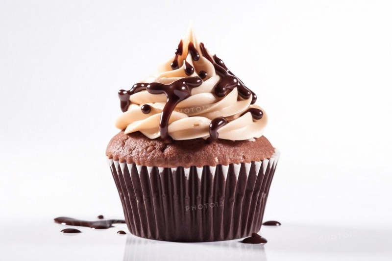 Chocolate cupcake with white frosting and chocolate sauce on white background. KI generiert, generiert, AI generated