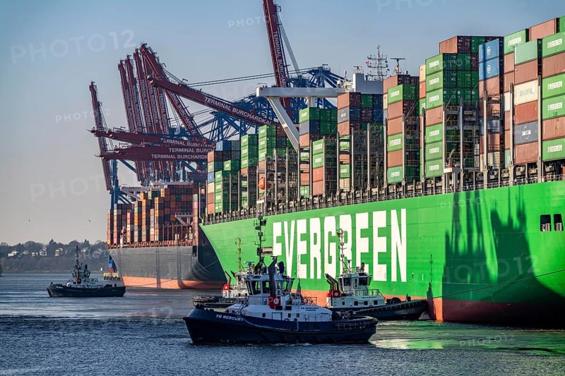 Container ship Ever Gifted, arriving at the port of Hamburg, Waltershofer Hafen, HHLA Container Terminal Burchardkai, 4 harbour tugs manoeuvre the ship to the quay, shipping company Evergreen, Singapore, 399 m long, can transport over 20, 000 containers, Hamburg, Germany, Asia