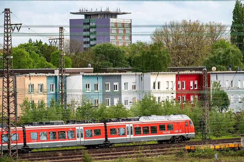 Railway line in Oberhausen, local train, Regional Express, at the exit of Oberhausen main station, direction east, North Rhine-Westphalia, Germany, Europe