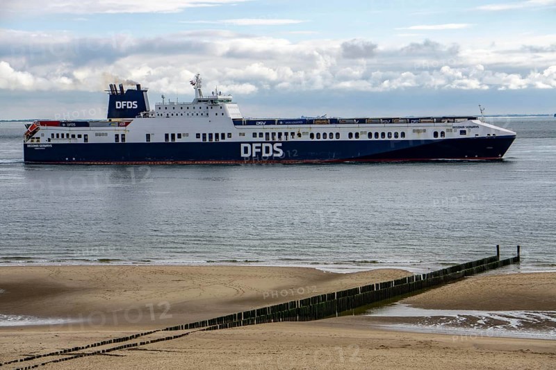 The DFDS cargo ferry Begonia Seaways, loaded with lorry trailers and new cars, leaves the Westerschelde and enters the North Sea at Zoutelande in the Netherlands, en route from Ghent in Belgium to Gothenburg, Sweden, Europe