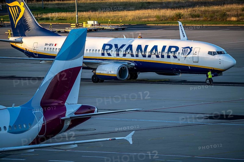 Eurowings Airbus A319 after landing on the way to Terminal 1, C-Gates, Ryanair Boeing 737 taxiing to the runway, Cologne-Bonn Airport, CGN, North Rhine-Westphalia, Germany, Europe