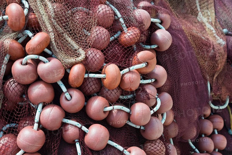 Close-up of fishing nets and orange buoys intertwined, Poros, Poros Island, Saronic Islands, Peloponnese, Greece, Europe