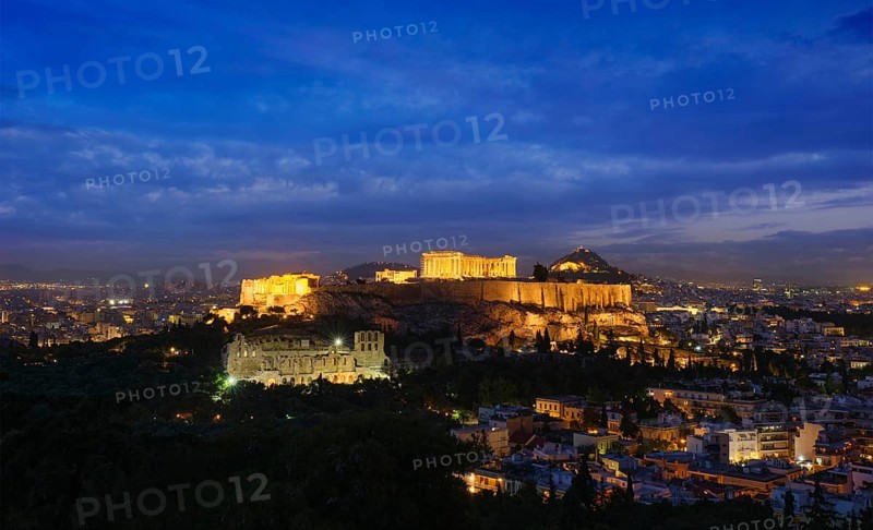 Famous greek tourist landmark, the iconic Parthenon Temple at the Acropolis of Athens as seen from Philopappos Hill in the evening blue hour, Athens, Greece, Europe