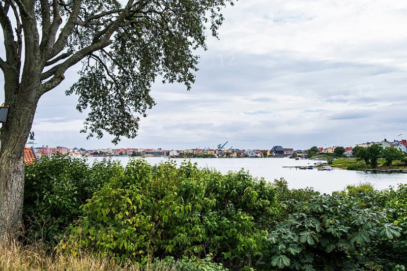 View from the famous allotment garden colony of Brändaholm on the island of Dragsö across the archipelago to the city skyline of the centre of Karlskrona, Blekinge län, Sweden, Europe