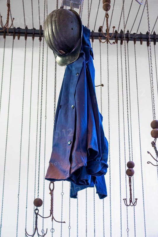Changing room with pulleys and chains to hoist coal miners clothes at Le Bois du Cazier, coal mining museum at Marcinelle, Charleroi, Hainaut, Belgium, Europe