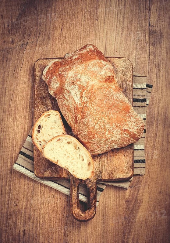 Sliced ciabatta, on a chopping board, italian bread, close-up, Italian cuisine, breakfast, no people
