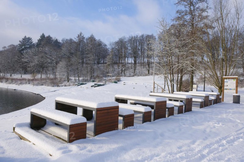 Rest area with snow-covered benches at the Hennesee, Hennetalsperre, Naturpark Sauerland-Rothaargebirge, Meschede, Sauerland, North Rhine-Westphalia, Germany, Europe