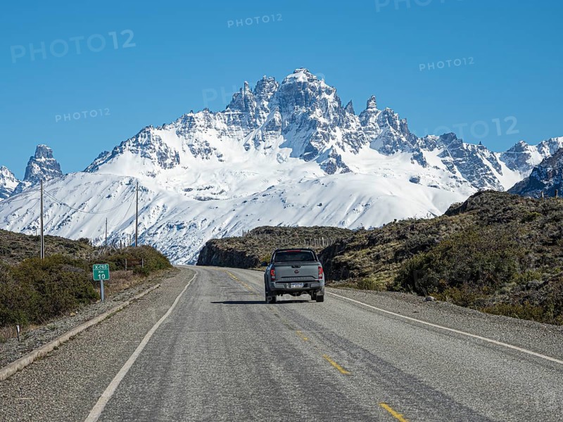 Snow-capped Mt. Cerro Castillo, pickup on rural road to Puerto Ingeniero Ibanez, east of Villa Cerro Castillo, Patagonia, Chile, South America