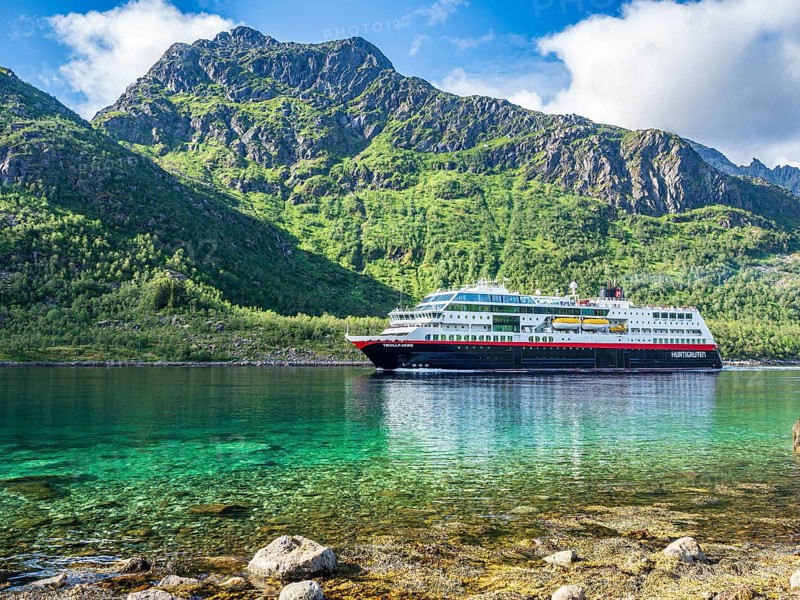 Hurtigruten cruise ship passing the Raftsund, the strait between islands Hinnøya and Austvågøya, surrounded by steep mountains, Norway, Europe