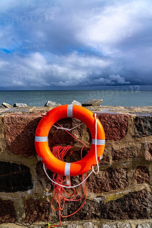 The city harbour of Sassnitz, island of Rügen, pier, harbour dam, dark rain clouds, lifebuoy, seagull, Mecklenburg-Western Pomerania, Germany, Europe