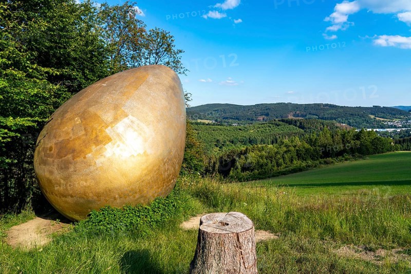 Forest Sculpture Trail Wittgensteiner Sauerland, 23 kilometre long trail, part of the Rothaarsteig, sculpture Was Was Zürst?, large golden egg, landscape in the Sauerland, Rothaargebirge, north-west, above the town of Bad Berleburg, North Rhine-Westphalia, Germany, Europe