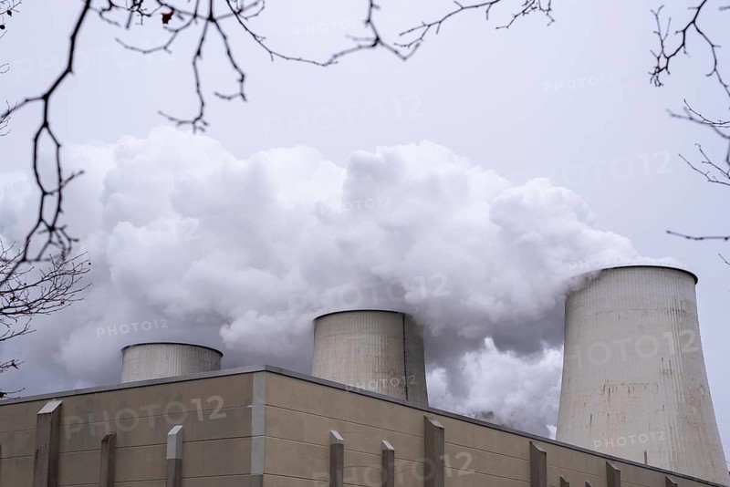 Water vapour rising from cooling towers, Jänschwalde lignite-fired power plant, Brandenburg, Germany, Europe