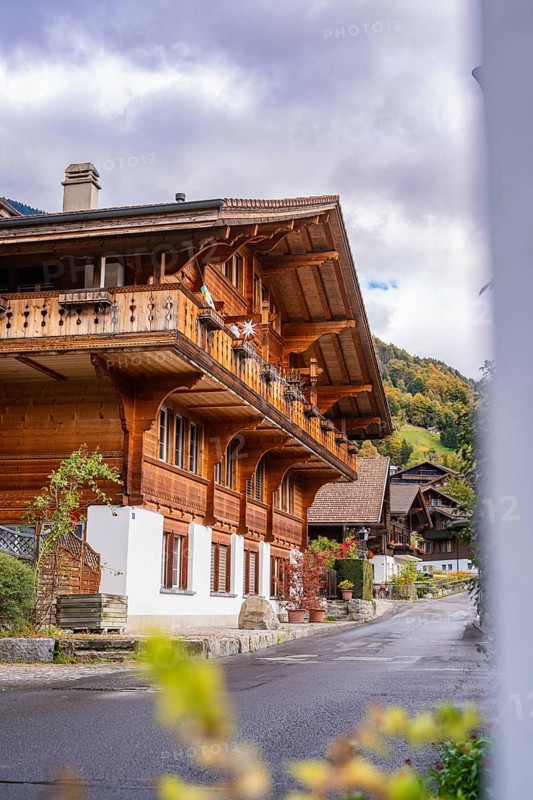 A traditional wooden chalet in a mountain village in autumn, Lake Brienz, Brienz, Switzerland, Europe