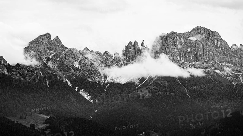 The peaks of the rose garden, shrouded in mist, drone shot, black and white image, Dolomites, Autonomous Province of Bolzano, South Tyrol, Italy, Europe