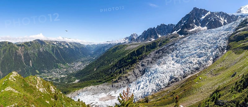 Panorama, mountain landscape with glacier Glacier des Bossons and summit of the Aiguille du Midi, view into the valley with the village of Chamonix, Chamonix, Haute-Savoie, France, Europe