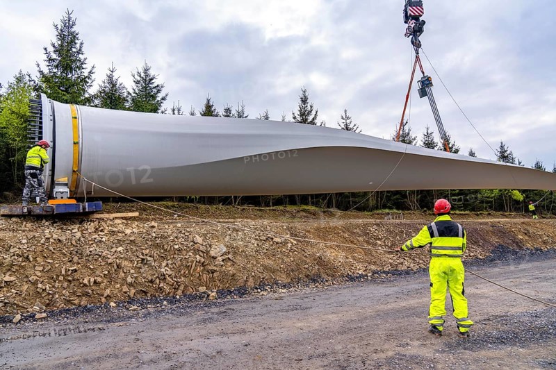 Erection of a wind turbine, wind energy plant, assembly of the third blade, with a crawler lattice crane, wind farm near Hagen, North Rhine-Westphalia, Germany, Europe