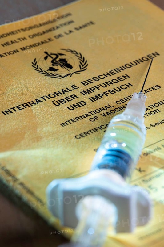 Symbolic photo vaccination, vaccination certificate, syringe with vaccine