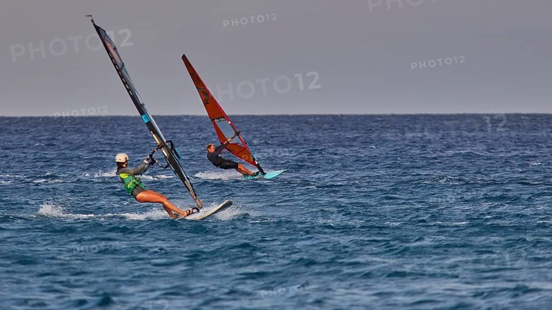 Two people windsurfing on the open sea under a clear sky, windsurfer, Meltemi windsurfing spot, Devils Bay, Paralia Vatha, Vatha Beach, south-east coast, Karpathos, Dodecanese, Greek Islands, Greece, Europe