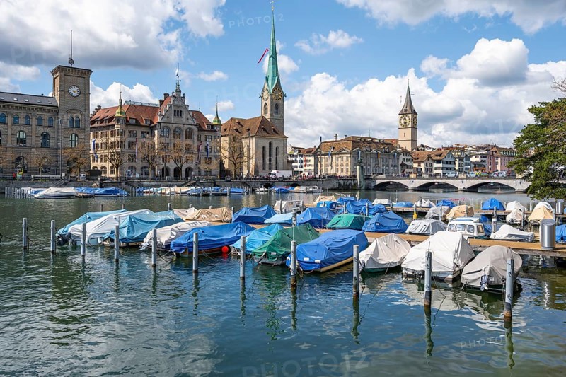 Boats at the jetty in the river Limmat, towers of Fraumünster and St Peter, Old Town, Zurich, Switzerland, Europe