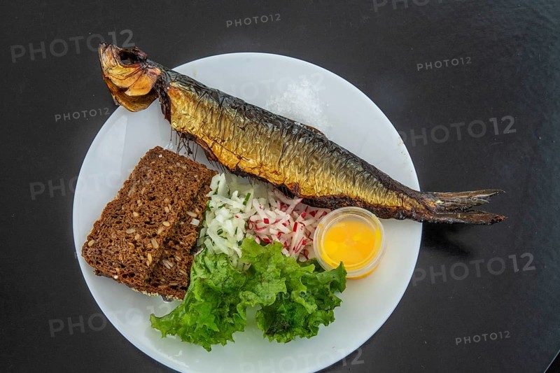 Traditional Bornholm dish: smoked fish, rye bread and vegetables in Gudhjem, Bornholm, Baltic Sea, Denmark, Scandinavia, Europe