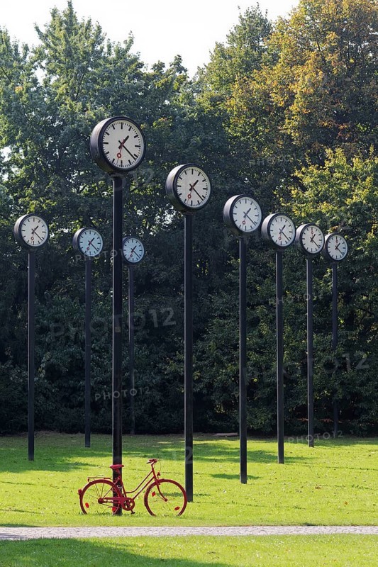 Station clocks with synchronised time, art installation Zeitfeld by Klaus Rinke in the Volksgarten Düsseldorf, North Rhine-Westphalia, Germany, Europe