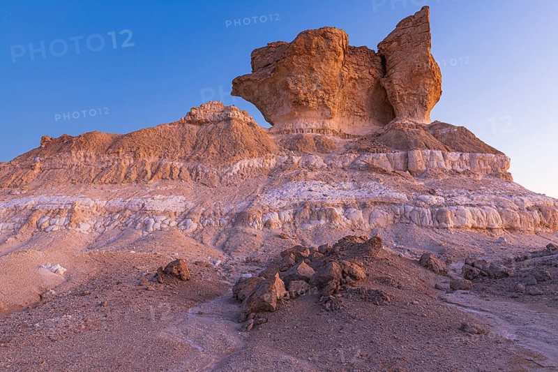 Eroded rock formations on a fossilised reef edge, at blue hour, Huqf stone desert, Arabian Peninsula, Sultanate of Oman