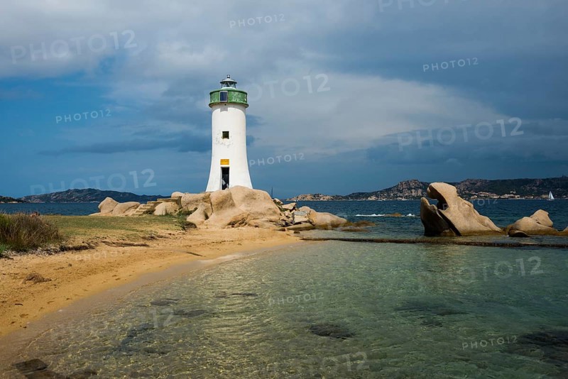 Lighthouse with beach and bizarre granite rocks, Spiaggia Porto Faro, Faro di Punta Palau, Palau, Costa Smeralda, Sardinia, Italy, Oceania