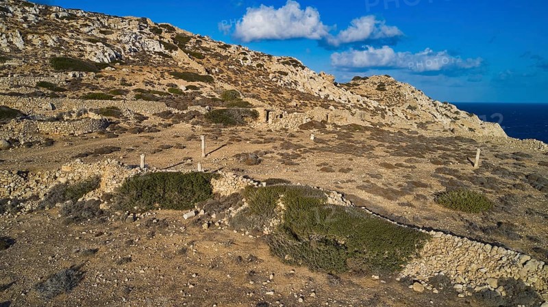 Drone shot, Archaeological site, Rocky landscape with ruins and sea view, Acropolis hill, Ruins of an acropolis, Arkasa, West coast, Karpathos, Dodecanese, Greek Islands, Greece, Europe