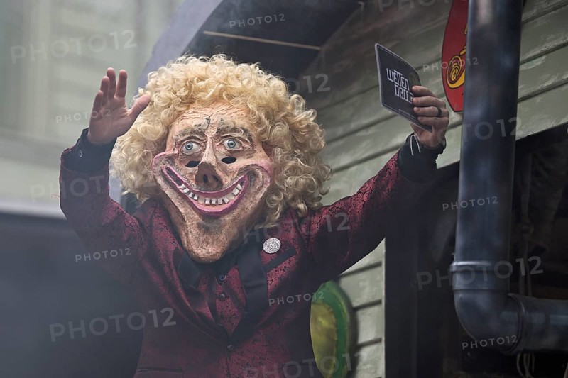 Person masked as Thomas Gottschalk at the carnival parade of the Wey guild on Rose Monday, Güdismäntig, Lucerne Carnival 2024, Lucerne, Switzerland, Europe