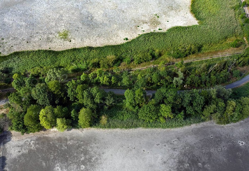 Aerial view of dried up fish ponds in Reckahn in Brandenburg. The Plane, a river that normally fills the fish ponds with water, is dry and no longer carries water, 09/08/2022