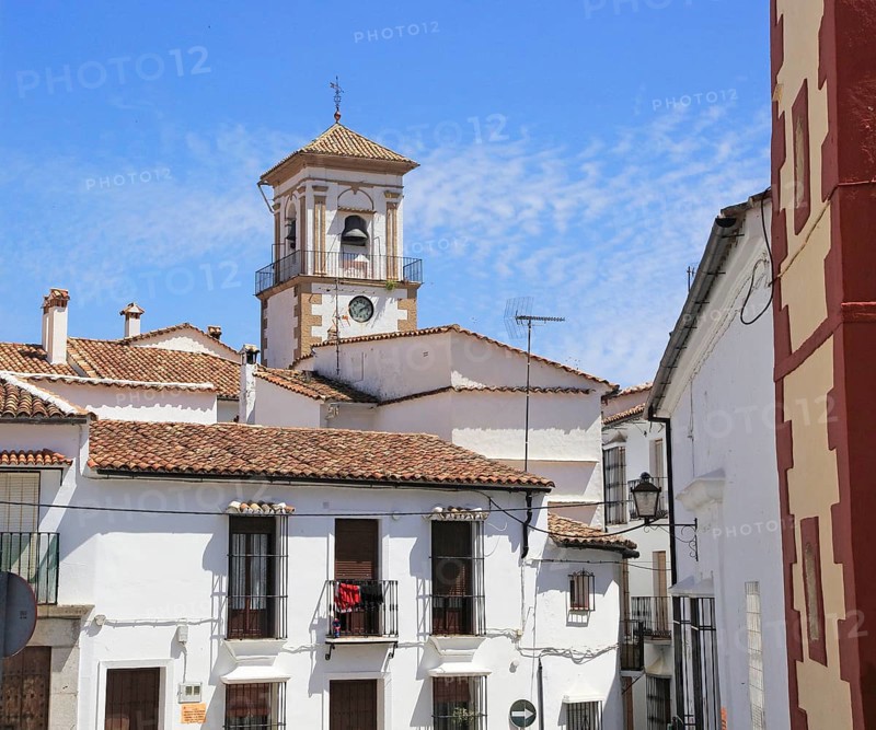 Whitewashed houses cluster around church tower, village of Grazalema, Cadiz province, Spain, Europe