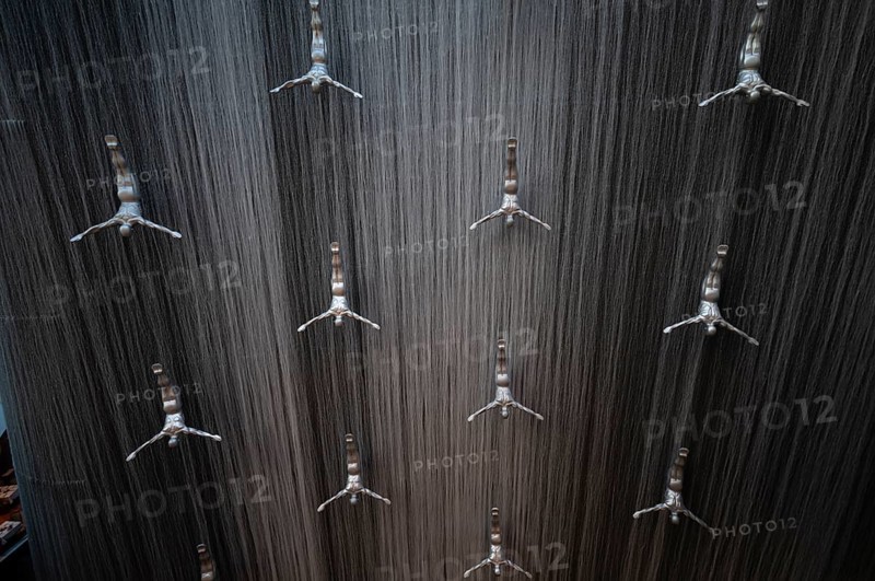 Interior view, The Waterfall, artificial indoor waterfall with life-size jumper sculptures, installation on the pearl diving tradition, Dubai Luxury Shopping Mall, luxury shopping centre, Downtown, Dubai, United Arab Emirates, Asia