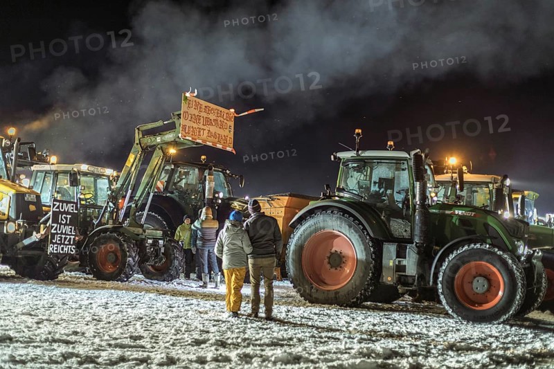 Tractors during a rally as part of the farmers' protests on the snow-covered Kirchbichl, Schliersee, Upper Bavaria, Bavaria, Germany, Europe