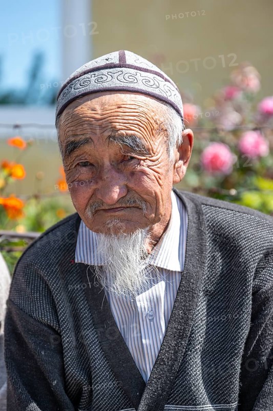 Portrait, local elderly man with traditional hat, Issyk-Kul region, Kyrgyzstan, Asia