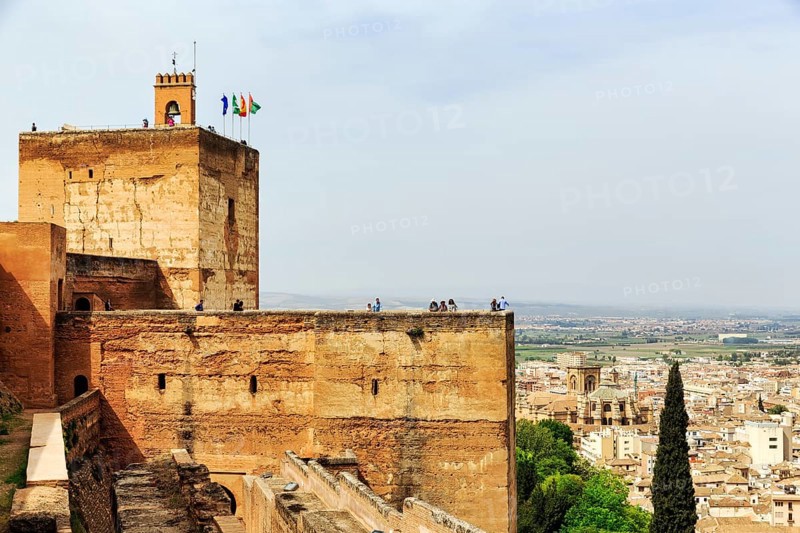 Watchtower with flags and tourists, Torre de la Vela, Alcazaba, Alhambra, Granada, Andalusia, Spain, Europe