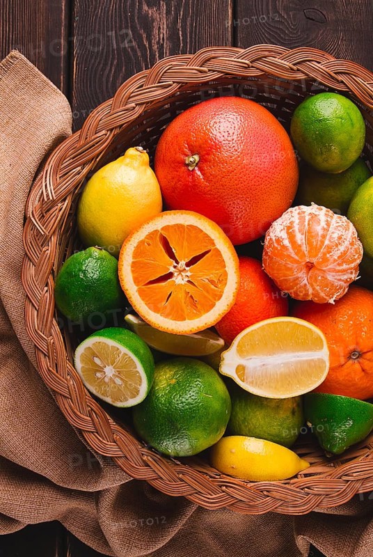 Assortment, citrus fruits, in a basket, close-up, top view, no people