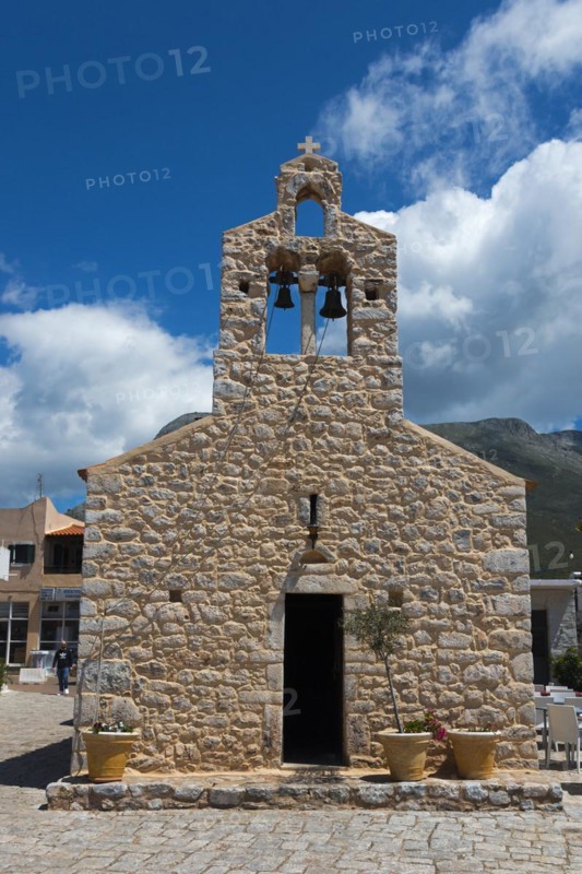 A traditional stone church with a bell tower under a clear blue sky and mountains in the background, Church of St Athanasios, Areopoli, Areopolis, Tsimova, Itylo, Anatoliki Mani, Mani, Laconia, Peloponnese, Greece, Europe