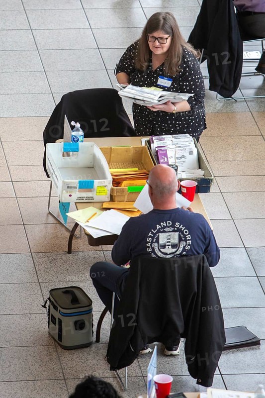 Warren, Michigan USA, 5 November 2024, Election workers open and verify absentee ballots on election day at the city's Civic Center. Warren's city clerk opted not to process these ballots in advance, as allowed by state law, raising fears that results from Michigan's third-largest city would not be available promptly