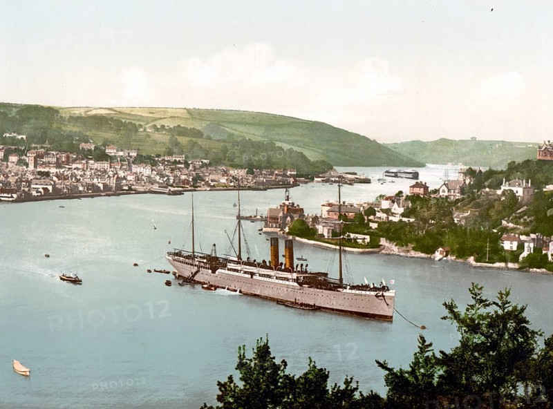 The RMS Dunottar Castle, a Royal Mail ship on the River Dart, Devon, England. The town of Dartmouth is on the left and Kingswear on the right, circa 1890, Historic, digitally restored reproduction from a 19th century original The RMS Dunottar Castle, a Royal Mail ship on the River Dart, England. The town of Dartmouth is on the left and Kingswear on the right, circa 1890, Historic, digitally restored reproduction from a 19th century original