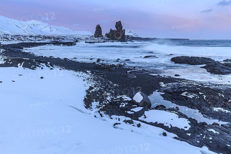 Rocks and surf on the coast, evening light, sun, snow, winter, Arnarstapi, Snaefellsnes, Vesturland, Iceland, Europe