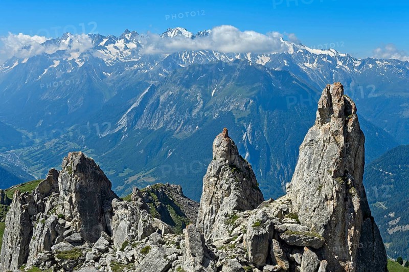 View over rocky outcrops on the slopes of the Pierre Avoi summit to the mountain range of the Savoy Alps, Valais Alps, Verbier, Valais, Switzerland, Europe