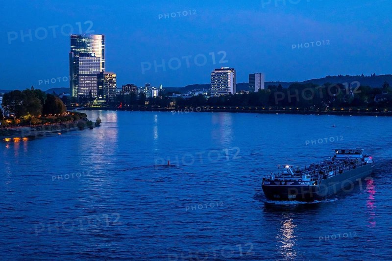 Skyline Bonn on the Rhine, in front the UNFCCC Secretariat of the Framework Convention on Climate Change, in the centre the high-rise building of the United Nations, Campus Bonn, behind it the Posttower, corporate headquarters of Deutsche Post, Rhine bank Bonn-Beuel, on the right the Bonn Marriott Hotel, tanker, North Rhine-Westphalia, Germany, Europe