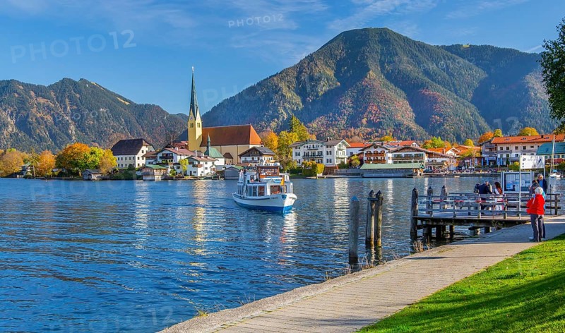Excursion boat atMalerwinkelblick with waterfront of the village, parish church St. Laurentius and Wallberg 1722m in autumn, Rottach-Egern, Tegernsee, Tegernsee Valley, Upper Bavaria, Bavaria, Germany, Europe