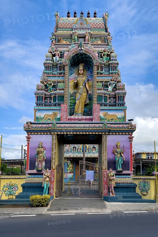 Portal tower with statues of deities Statues of deities at the entrance to Hindu temple Shri Sri Draupadi Amman Kovil Temple, Cap Malheureux, Mauritius, Africa