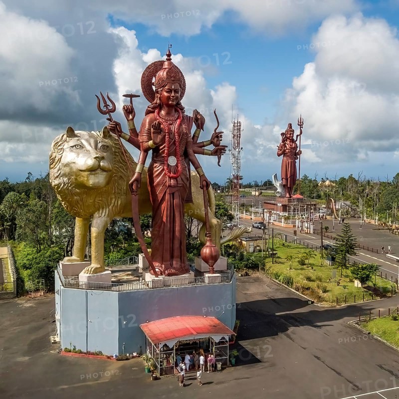 Aerial view of larger than life giant Hindu statue of front Goddess Durga Mata with lion in background giant sculpture figure of God Lord Shiva of Hindu religion Hinduism, Ganga Talao, Le Pétrin, Mauritius, Africa