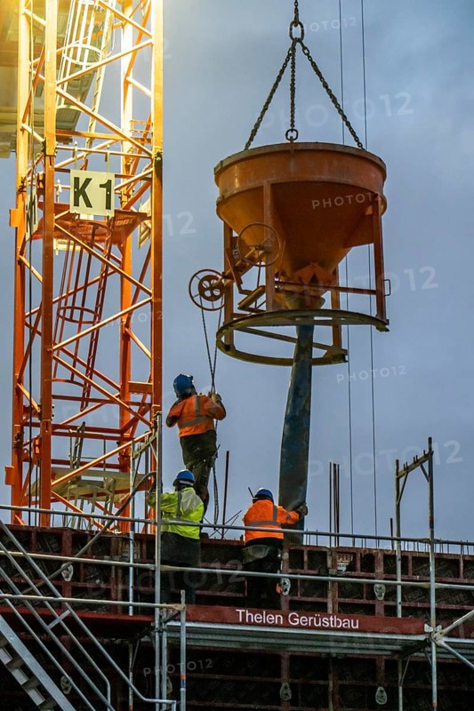 Concrete work, at dusk, on a large construction site building a residential and commercial complex, North Rhine-Westphalia, Germany, Europe