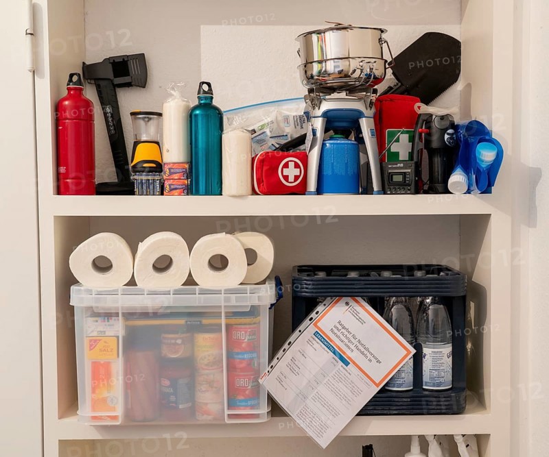 Emergency preparedness, food supply in a private household, box of long-life food, 10-day supply, according to the recommendations of the Federal Office of Civil Protection and Disaster Assistance, emergency supplies, cooker, tools, candles, water canister, water filter
