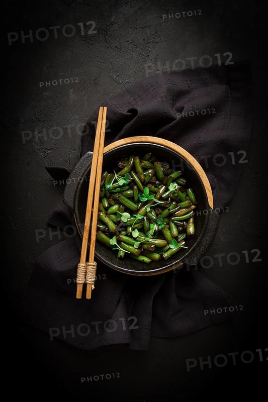 Fried bean pods, in soy sauce, with sesame seeds, homemade, no people